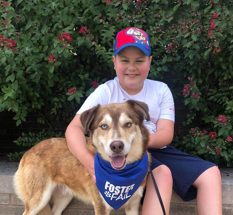 young boy with his rescued dog